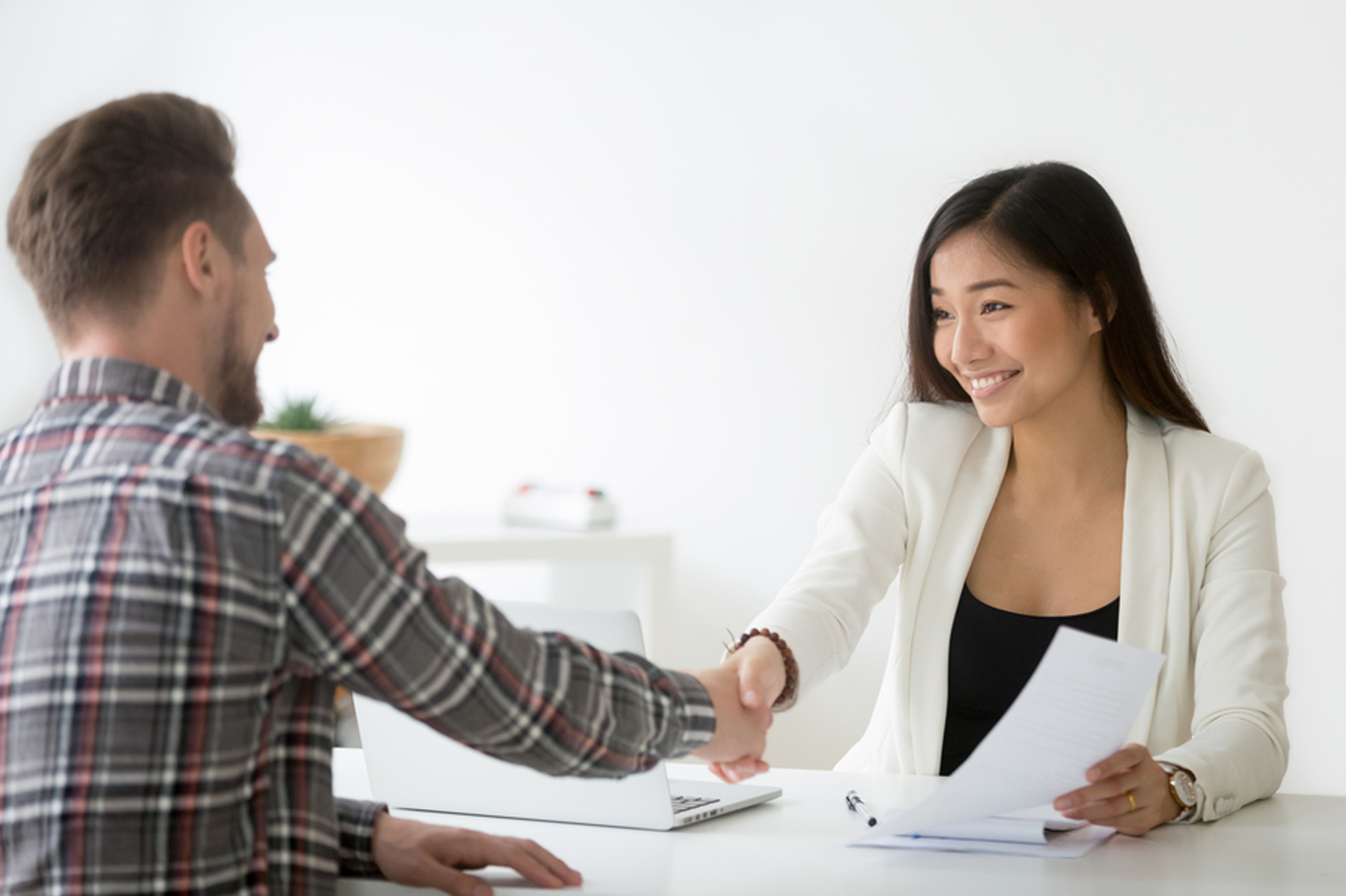 Banker shaking the hand of a customer.